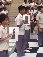 Students take their places as pieces on the chess board