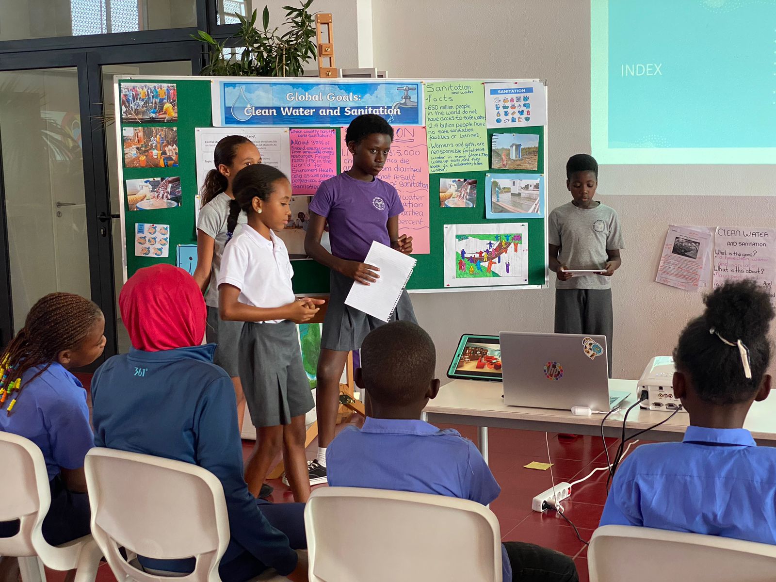 Students presenting on clean water and sanitation