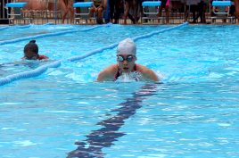 Students competing in 200m breastroke race